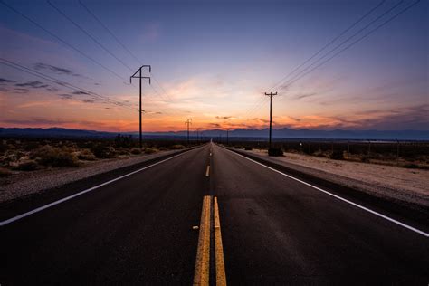 Concrete Road Road Sunset Desert Clouds Hd Wallpaper Wallpaper Flare