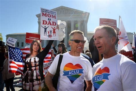 Both Sides Of The Same Sex Marriage Case Duel With Signs And Slogans