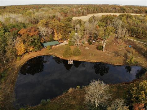 3 Homes on 10 acres with fully stocked spring fed pond in Wayne County