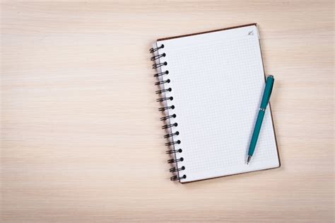 Blank Notebook And Pen On The Table Photo Premium Download