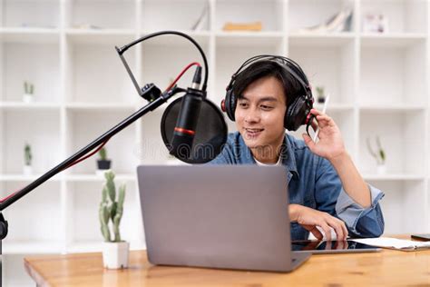 Man And Woman Podcasters Interview Each Other For Radio Podcast Stock