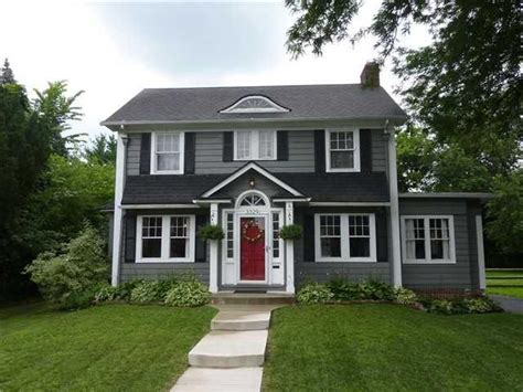 Thinking of getting your house roof painted? Dark Gray Shingles, Black Roof & Shutters with White Trim ...