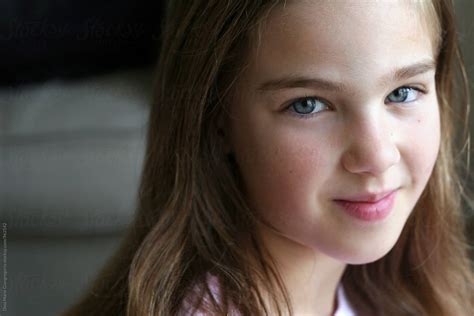 Pretty Pre Teen Girl In Natural Light Smiling By Stocksy Contributor