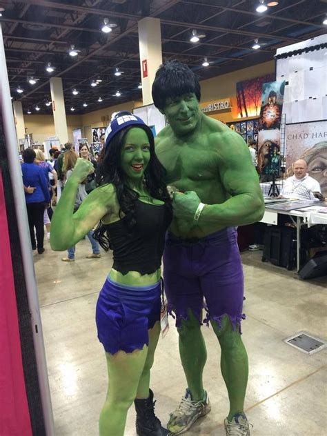 A Man And Woman Dressed Up As The Incredible Hulk