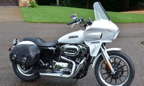 A White And Black Motorcycle Parked On The Street