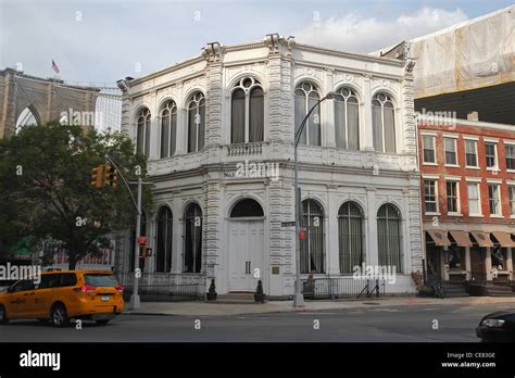 An Old Brooklyn Building With The Brooklyn Bridge In The Background