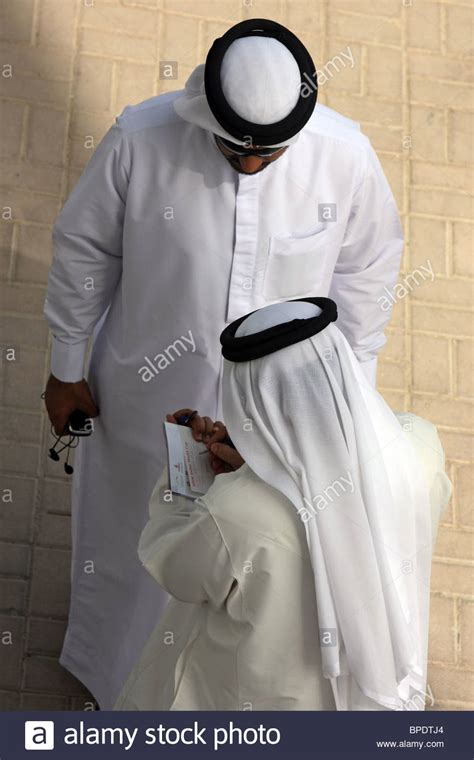 Men's slim fit suit separates. Men in national clothing, Dubai, United Arab Emirates ...