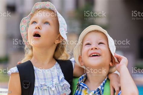 Closeup Of Amazed Little Girl And Boy Hugging Stock Photo Download