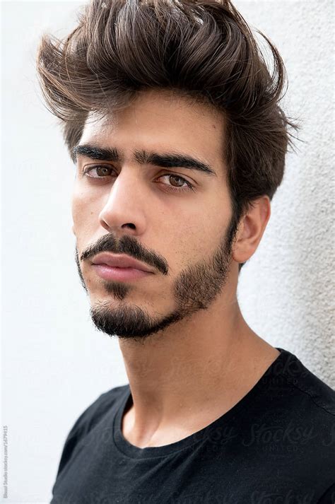 Portrait Of A Handsome Young Man With Goatee Looking At Camera Del