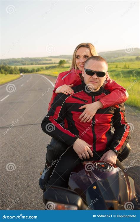 Biker Man And Woman Sitting On A Motorcycle Stock Image Image Of