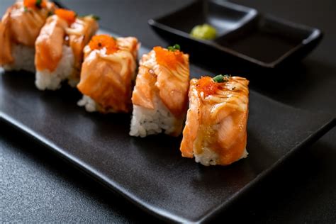 Premium Photo Grilled Salmon Sushi Roll With Sauce