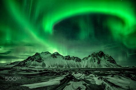 Northern Lights Over The Mountains At Stokksnes Höfn Iceland Photo