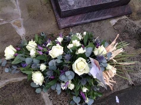 It's so hard to think of what to write as an appropriate message on finally we have another 10 short messages for use on funeral wreath banners. Funeral Flowers - A Beautiful Rose and Thistle Spray