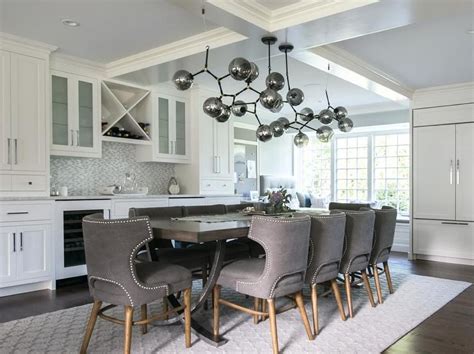 Needed something for small dining area in apartment and this fits perfectly. Contemporary white and gray dining room showcases a stunning gray glass modular chandelier hung ...