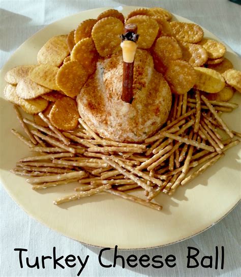 A Turkey Cheese Ball Made Out Of Crackers On A Plate