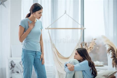 Mom Conducting Educational Conversation With Naughty Daughter Stock