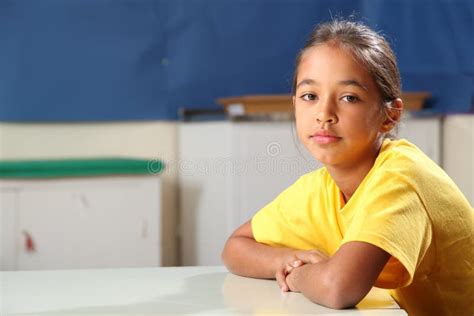 School Girl 10 Arms Folded At Her Classroom Desk Stock Image Image Of