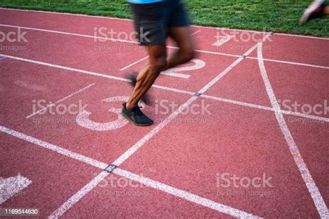 Athletes Crossing The Finish Line Stock Photo Download Image Now