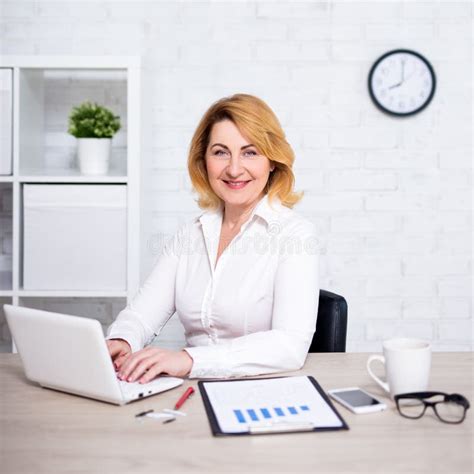 Portrait Of Mature Business Woman Working In Office Stock Image Image