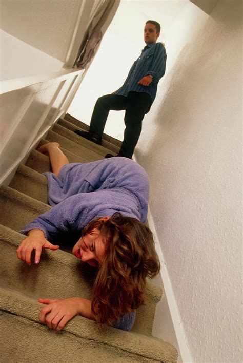 Woman Being Pushed Downstairs By Her Partner Photograph By Jim Varney