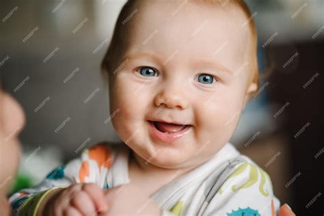 Premium Photo Baby Portrait Closeup Face With Bright Blue Eyes Boy