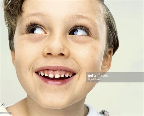 Smiling Young Boy Looking Sideways High Res Stock Photo Getty Images
