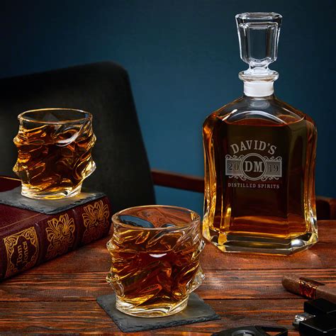 Premium whiskey, scotch, bourbon, rye & rum decanter set comes complete with a hand blown, elegantly crafted 1000 ml globe decanter with a unique and intricate glass blown skull inside; Marquee Personalized Decanter Set with Sculpted Glasses
