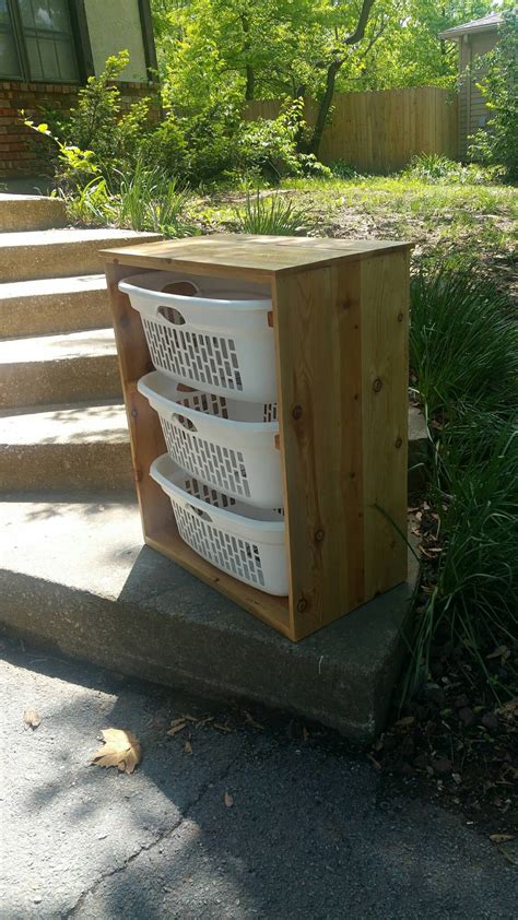 Originally designed for holding dirty laundry by the poolside the teak laundry basket is versatile enough to be used for holding anything from children's toys to lawn care items. Rustic laundry basket holder | Etsy | Laundry basket ...