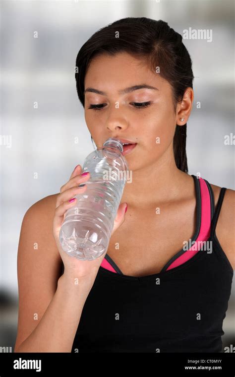 Teen Girl Drinking Water At The Gym Stock Photo Alamy