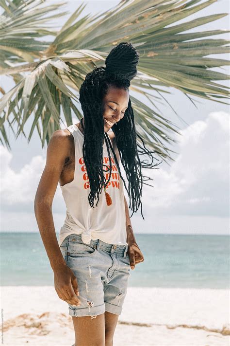 Portrait Of A Beautiful African American Woman At The Beach By Stocksy Contributor Andrey