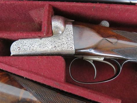 A Pair Of 12 Bore Shotguns By Famous London Gun Maker John Blanch And Son