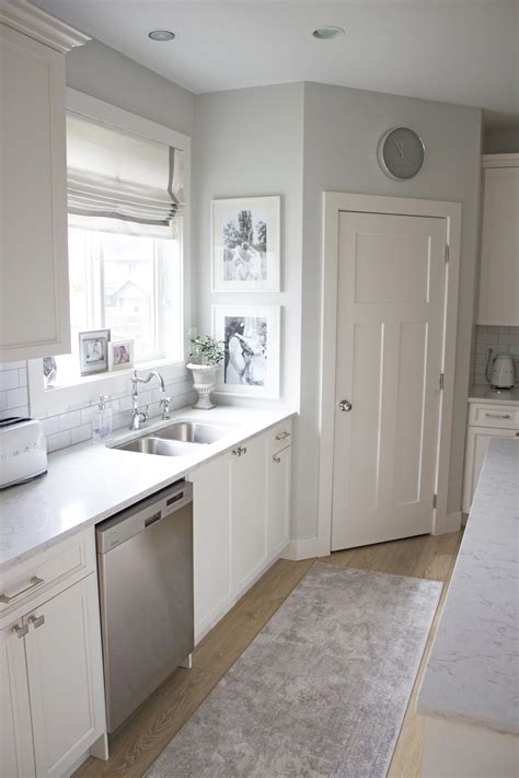When you want to pair your white kitchen cabinets with gray wall paint but do not want the wall to look cool or neutral, you can choose greige instead. Bright White Kitchen Reveal grey walls # ...