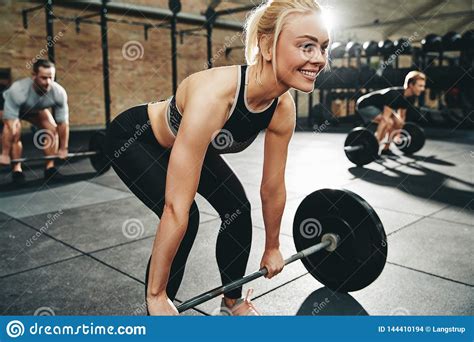 Fit Man Smiling During A Gym Weightlifting Class Stock Photo Image Of