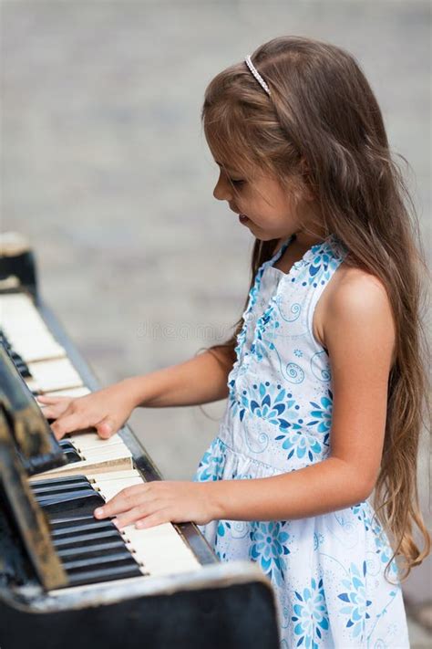 Little Girl Playing On A Piano Stock Photo Image Of Performance
