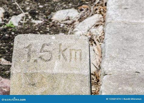 Old Kilometer Stone Says ` 15 Km` To Get Into The Destination Stock