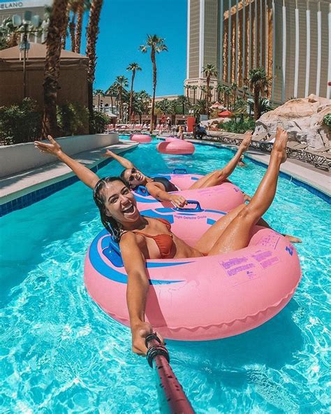 Two Women On Inflatable Rafts At The Mirage Hotel Pool