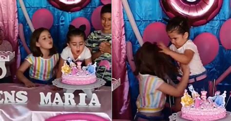 video niña le apaga la vela de cumpleaños a su hermanita