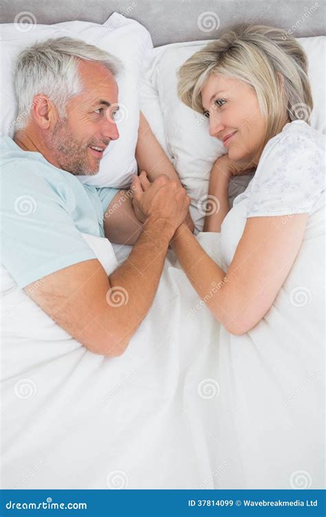 loving mature man and woman lying in bed stock image image of relationship love 37814099