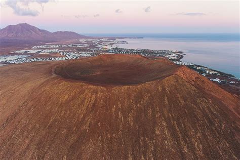 Traveling in Lanzarote Montaña Roja volcano in Playa Blanca Drone