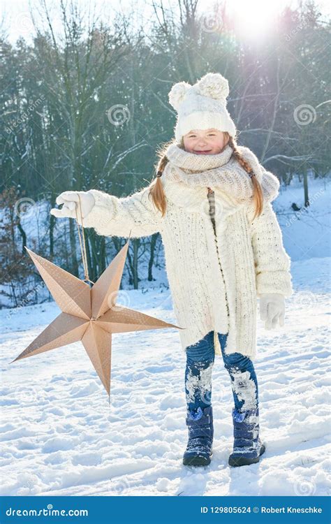Child Holds Christmas Star In Winter Stock Photo Image Of Star