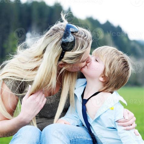 Mother Son Outdoors Kissing Stock Photo At Vecteezy
