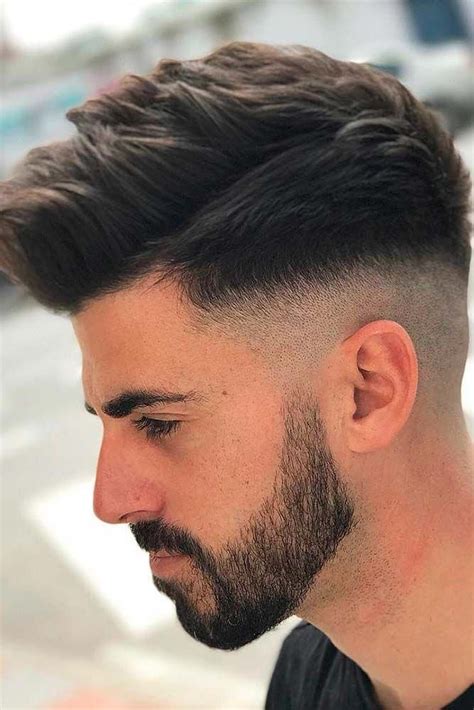 The classic fade haircuts leave a healthy length of hair up top (>3) and taper down from one part line until it lightens up significantly towards the neckline. Long Comb Over Fade Haircut Messy Textured Top ️ Many ...