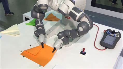 Dual Arm Collaborative Yumi Robot Makes Paper Aeroplanes Abb Robotics