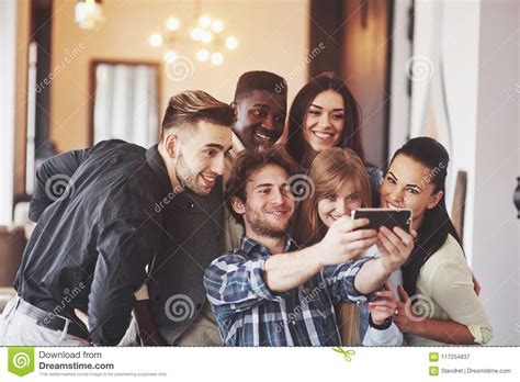Multiracial People Having Fun At Cafe Taking A Selfie With Mobile Phone