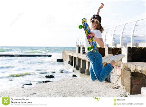 Woman With A Skateboard On A Beach Stock Image Image Of Leisure