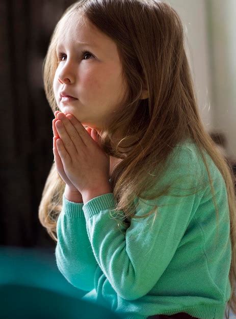 Free Photo Front View Of Beautiful Little Girl Praying