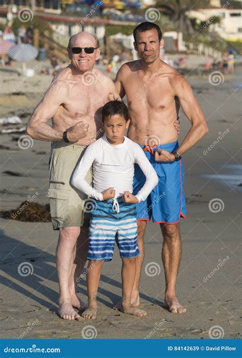 Grandpa Son And Grandson Flexing Thier Muscles On Venice Beach Stock