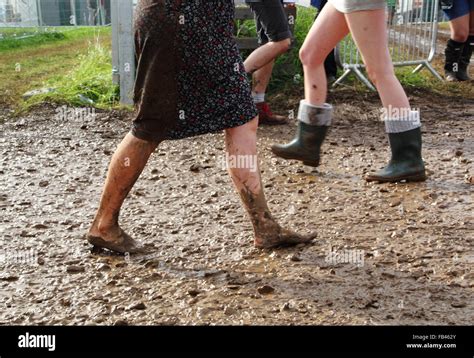 woman walking barefoot in mud