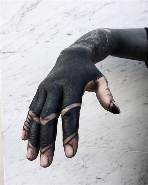 These Striking Solid Black Tattoos Will Make You Want To Go All In