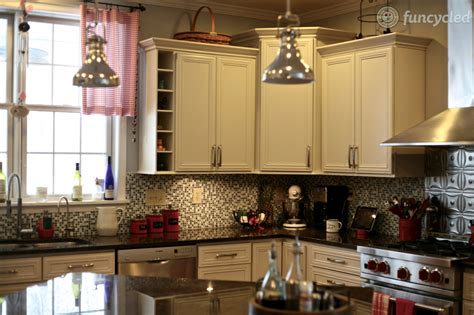 The paint is thicker than stain; Benjamin Moore's Wind's Breath Painted Kitchen Cabinets - FunCycled